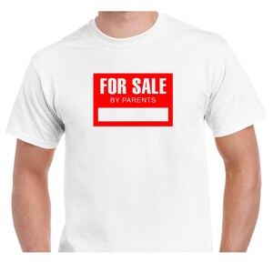 May include: White t-shirt featuring a red rectangular graphic with the white text "FOR SALE BY PARENTS". The graphic also has a white rectangular space below the text.