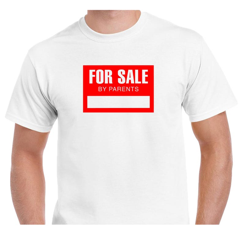 May include: White t-shirt featuring a red rectangular graphic with the white text "FOR SALE BY PARENTS". The graphic also has a white rectangular space below the text.