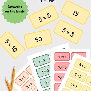 May include: Multiplication flash cards 1-10 with a green starburst graphic stating Answers on the back. The set includes yellow, green, pink, and orange rectangular cards featuring math equations and products, accompanied by two yellow pencils.
