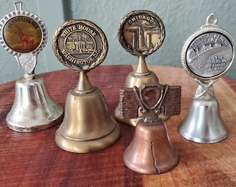 5 vintage metal souvenir bells,  featuring various landmarks such as the White House & US Capitol,collectible