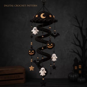 May include: A hanging spiral crochet mobile featuring black yarn with dangling white ghosts, orange jack-o'-lanterns, black bats, and gold stars. The top canopy is decorated with a yellow crescent moon and stars. Text reads DIGITAL CROCHET PATTERN.