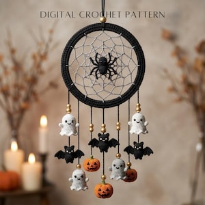 May include: A digital crochet pattern for a Halloween-themed wall hanging featuring a black circular frame with a grey web and a central black spider. Dangling from the frame are crocheted ghosts, bats, and pumpkins accented with gold beads.