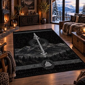 May include: A rectangular area rug featuring a black and white design with a central vertical spear, a compass symbol, and a mountain landscape. The rug includes borders with intricate knotwork patterns and rows of runic inscriptions throughout.