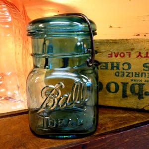 One Aqua IMPERFECT Pint Sized SQUARE Ball Ideal Jar with Aqua Colored Glass Lid and Rusty Wire Bail Uncommon Square Shape
