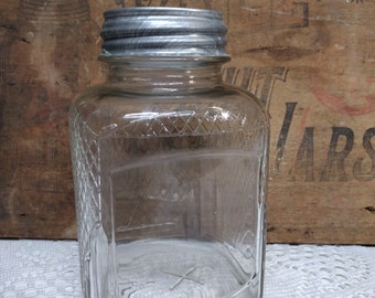 One Vintage IMPERFECT Clear Square Shaped Product or Coffee Jar with New Old Stock Unmarked Standard Mouth Zinc Lid Patchy Haze to Base