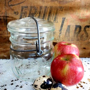 One Vintage Clear WIDE MOUTH Squatty Pint Atlas WholeFruit Jar with Wire Bail and Starburst Glass Lid Lines in the Glass Jar is NOT Perfect