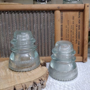 Two Vintage IMPERFECT Very Light Aqua Glass Insulators Hemingray 42 Made In USA Small Chip to One Insulator Heavy Scuffing Some Haze