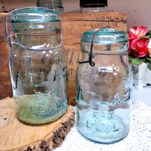 Two Antique Atlas E-Z Seal Quart Sized Light Icy Aqua Jars with Light Aqua Glass Lids SMALL CHIP to Lip of One Jar Small Patch of HAZE