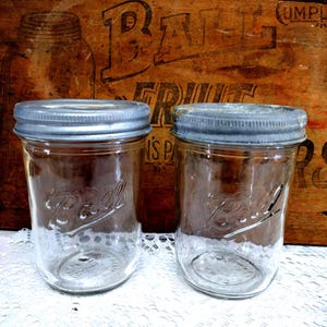 Two Clear Retro Pint Sized Tapered WIDE MOUTH Ball Canning Jars with Measuring Increments on the Reverse with VERY Rustic Zinc Freezer Caps