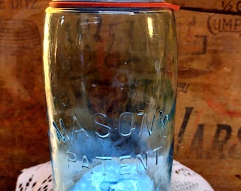 One Antique IMPERFECT Mason's Patent Jar Aqua Colored Quart Sized Jar with Rustic Zinc Lid Cold Mold Whittle Light HAZE to front of CRUDE