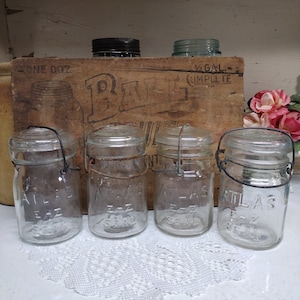 4 Vintage IMPERFECT Clear Atlas E-Z Seal Pint Sized Jars with Scratch and Dent Clear Glass Regular or Standard Star Pattern Glass Lids