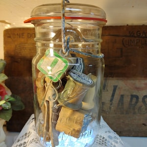 One vintage IMPERFECT quart sized Ball Eclipse WIDE MOUTH jar wire bail glass lid filled wooden thread spools, small blocks, clothespins
