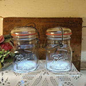 Two Vintage IMPERFECT Clear Ball Ideal Square Shaped Pint-Sized Jars with Regular or Standard Mouth Clear Glass Lids Bails are Tricky