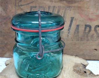 One REPRODUCTION Vintage Half Pint Sized Ball Ideal Aqua Colored Jar with Eagle on Reverse Bicenntenial SCUFFING to Top of Lid Bail is Tight