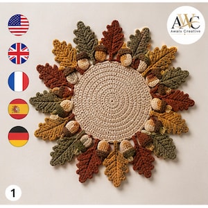 May include: A circular crochet mat featuring a beige center with a spiral pattern, surrounded by a decorative border of crocheted oak leaves in shades of rust, olive green, and mustard yellow, interspersed with small crocheted acorns.
