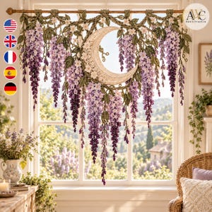 May include: A decorative wall hanging featuring a large, central cream-colored crescent moon surrounded by cascading purple and lavender wisteria flowers and green leaves. The intricate crochet design is suspended from a horizontal wooden rod.
