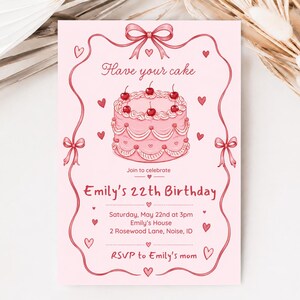 Puede incluir: Una tarjeta de invitación de cumpleaños rosa claro con una ilustración central de un pastel rosa cubierto con cerezas. El texto dice: Have your cake, Join to celebrate, Emily's 22th Birthday, Saturday, May 22nd at 3pm, Emily's House, 2 Rosewood Lane, Noise, ID, RSVP to Emily's mom. El diseño incluye un borde de cinta decorativa con corazones pequeños.