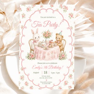 May include: A rectangular invitation card featuring a pink floral border and a central illustration of a rabbit and a teddy bear at a tea party. The text reads: You are invited to a Tea Party! Please join us to celebrate Emily's 5th Birthday!