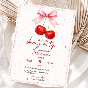 May include: A white rectangular invitation card with a scalloped edge, featuring a pink bow tied to two red cherries at the top. The text reads: She's the cherry on top, Please join us to celebrate Michaela, turning 30, Sept 8, 6 pm, 10633 Half-Mile Lane, Baroda, MI, RSVP to Cody by September 1st 269-240-3784, Join us for Dinner, Cake & Fun.