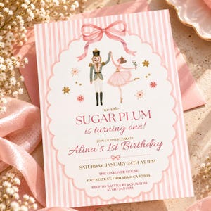 シュガープラムの1歳の誕生日招待状、くるみ割り人形の誕生日パーティー、ピンクのバレエの編集可能なCanvaテンプレート