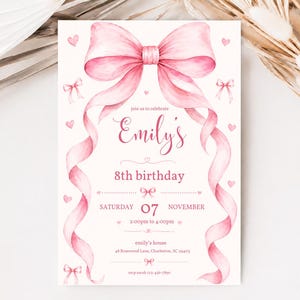 May include: A rectangular birthday invitation card featuring a large watercolor pink bow at the top with long flowing ribbons down the sides. The text reads Emily's 8th birthday, Saturday 07 November, 2:00pm to 4:00pm, emily's house, 48 Rosewood Lane, Charleston, SC 29403, rsvp sarah 123-456-7890.