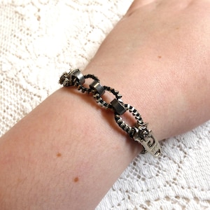 May include: A set of three ceramic mugs with a speckled, matte finish. The mugs are in shades of cream, light brown, and dark brown. Each mug has a simple, minimalist design and a rounded handle.