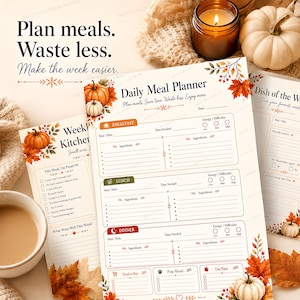 A top-down view of the fall daily meal planner template surrounded by a mug of coffee, a knit blanket, pumpkins, and autumn leaves.