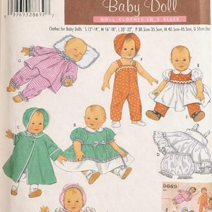 May include: Simplicity Baby Doll sewing pattern featuring doll clothes in three sizes. The pattern includes illustrations of various outfits, such as a pink and white checkered pajama set, a green coat, and a white dress with a red collar.