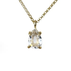May include: A gold chain necklace with a pear-shaped clear crystal pendant.