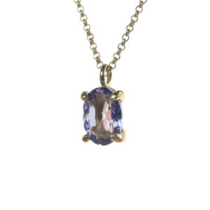 May include: A gold chain necklace with a pendant featuring a purple oval gemstone.