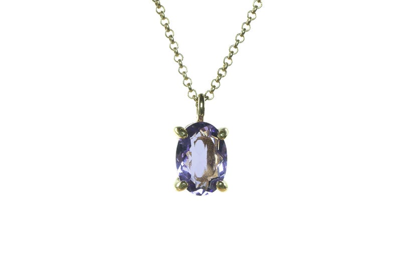 May include: A gold chain necklace with a purple oval gemstone pendant.