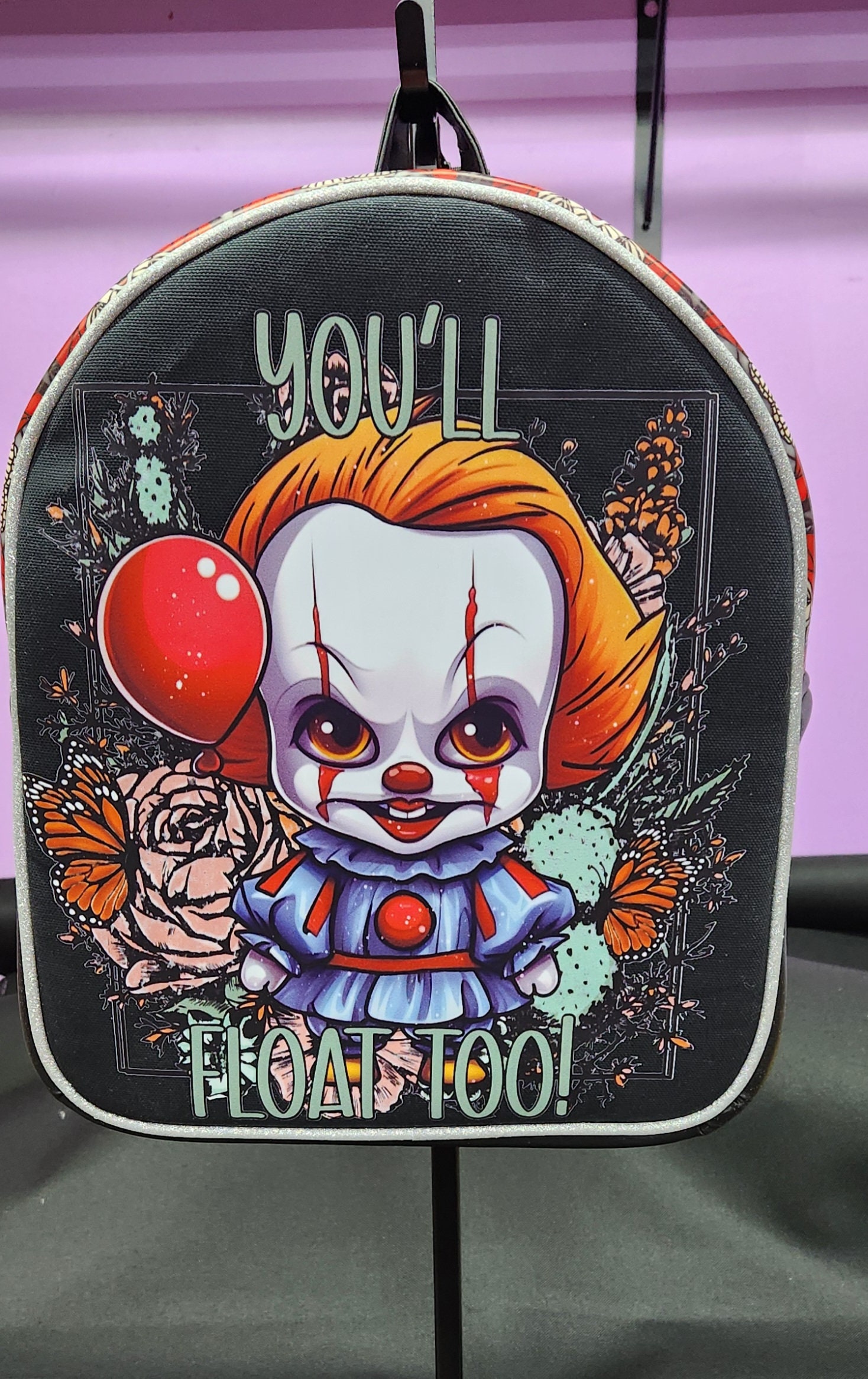 ISO Killer Klowns Black Multi-Color Tote Backpack with Clown Charm Killer Klown merchandise is making its way to the parks  main image 3