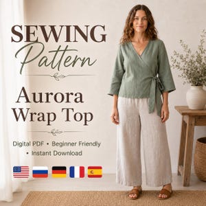 May include: A digital PDF sewing pattern for the Aurora Wrap Top, featuring a sage green wrap-style blouse with three-quarter sleeves and a side tie, paired with wide-leg beige trousers. The text reads SEWING PATTERN Aurora Wrap Top.