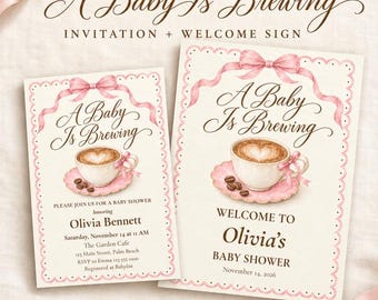 May include: Two rectangular paper cards featuring the text A Baby Is Brewing in brown script. Each card displays a watercolor illustration of a coffee cup on a pink saucer with a pink ribbon bow at the top and a scalloped border design.