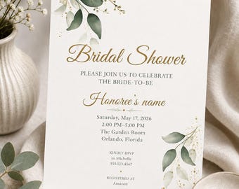 May include: A white bridal shower invitation card featuring watercolor green leaves and gold speckles. The text reads: Bridal Shower, PLEASE JOIN US TO CELEBRATE THE BRIDE-TO-BE, Honoree's name, Saturday, May 17, 2026, 2:00 PM-5:00 PM, The Garden Room, Orlando, Florida, KINDLY RSVP to Michelle 555.123.4567, REGISTERED AT Amazon.