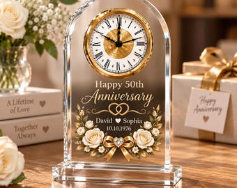 May include: An arched clear glass clock featuring a gold-rimmed face with Roman numerals. The glass is etched with "Happy 50th Anniversary," two interlocking rings, the names "David" and "Sophia," the date "10.10.1976," and floral graphics.