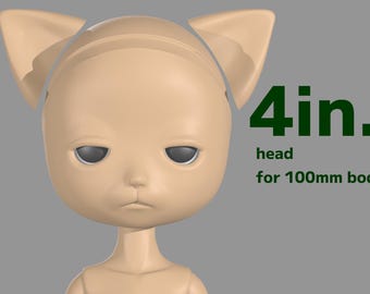 May include: A tan-colored doll head with cat ears, featuring a neutral expression and gray eyes. The text "4in. head for 100mm body" is displayed in green. The head is designed for a 4-inch doll body.