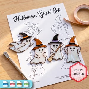 May include: A Halloween Ghost Set pattern sheet with four finished stained glass ghost ornaments featuring witch hats. The paper includes numbered outlines for assembly, a hobby licence stamp, and a metal craft knife tool is placed on the side.