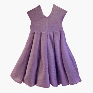 May include: A purple sleeveless dress with a gathered skirt. The dress is made of a knit fabric with a subtle shimmer.