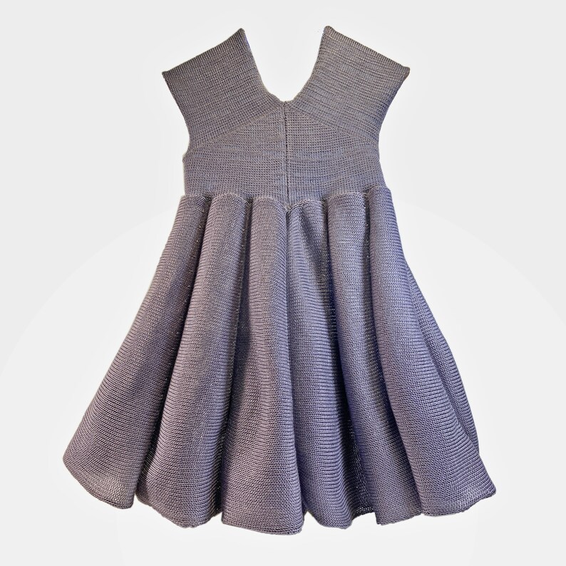 May include: A sleeveless, gray, knit dress with a gathered skirt.