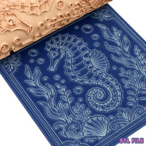 May include: A light-colored wooden rolling pin with a carved seahorse and seaweed pattern positioned above a dark blue square tile featuring an embossed, raised design of a seahorse, aquatic plants, bubbles, and a seashell, with the text STL FILE.