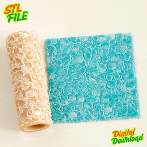May include: A cylindrical beige rolling pin with a raised seashell texture pattern next to a square piece of bright turquoise material featuring the same embossed seashell design, labeled with the text STL FILE and Digital Download.
