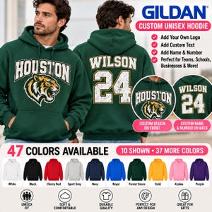 May include: A dark green Gildan unisex hoodie featuring a white tiger graphic and the text HOUSTON on the front, with the name WILSON and the number 24 printed on the back. The hoodie includes a drawstring hood and a front kangaroo pocket.
