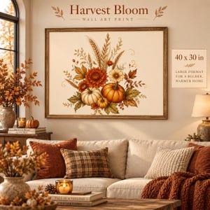 Puede incluir: Una impresión de arte mural rectangular titulada Harvest Bloom que presenta una ilustración botánica de calabazas naranjas y blancas, tallos de trigo y hojas de otoño en un marco de madera, con una medida de 101,6 x 76,2 cm.