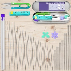 May include: A beading needle set including a metal storage tin labeled BEADING NEEDLES SET, green and blue thread snips, a turquoise measuring tape, a clear tube with a purple cap, two flower-shaped needle threaders, and various long needles.