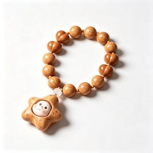 May include: A bracelet composed of smooth, round, light brown wooden beads strung together. A single, larger, star-shaped wooden charm hangs from the bracelet, featuring a small, pale, smiling face embedded in its center with a tiny white bead.