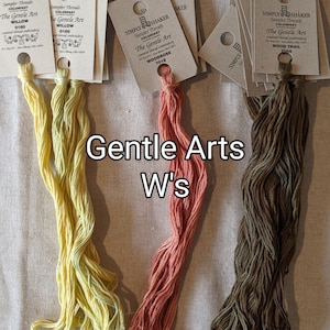 May include: Three skeins of embroidery floss in yellow, orange, and brown. The floss is labeled "The Gentle Art" with the color names "Willow", "Woodrose", and "Wood Trail".
