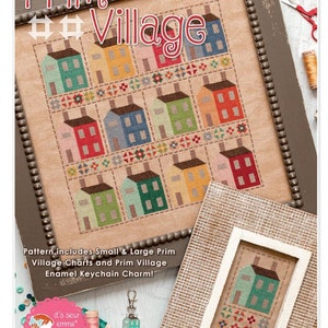 Peut inclure: Image d'une broderie au point de croix encadrée intitulée "Prim Village", représentant des maisons colorées dans une grille. L'image comprend un petit échantillon encadré et un porte-clés. Le texte sur l'image indique "Pattern includes Small & Large Prim Village Charts and Prim Village Enamel Keychain Charm!"