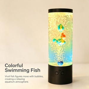 May include: A cylindrical LED bubble lamp with a black base and top, featuring internal liquid with rising bubbles and three small, colorful artificial fish figures. The text "Colorful Swimming Fish" is printed on the left side of the image.