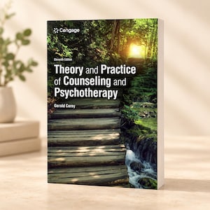 以下が含まれることがあります： ジェラルド・コーリー著の教科書『Theory and Practice of Counseling and Psychotherapy, Eleventh Edition』。表紙には、緑豊かな森の中を明るい光に向かって続く木製の小道と、その横を流れる小川が描かれています。